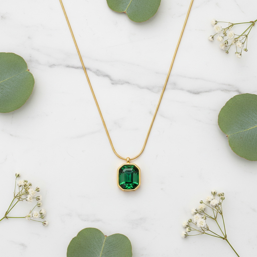 Emerald Necklace on Marble with Flowers